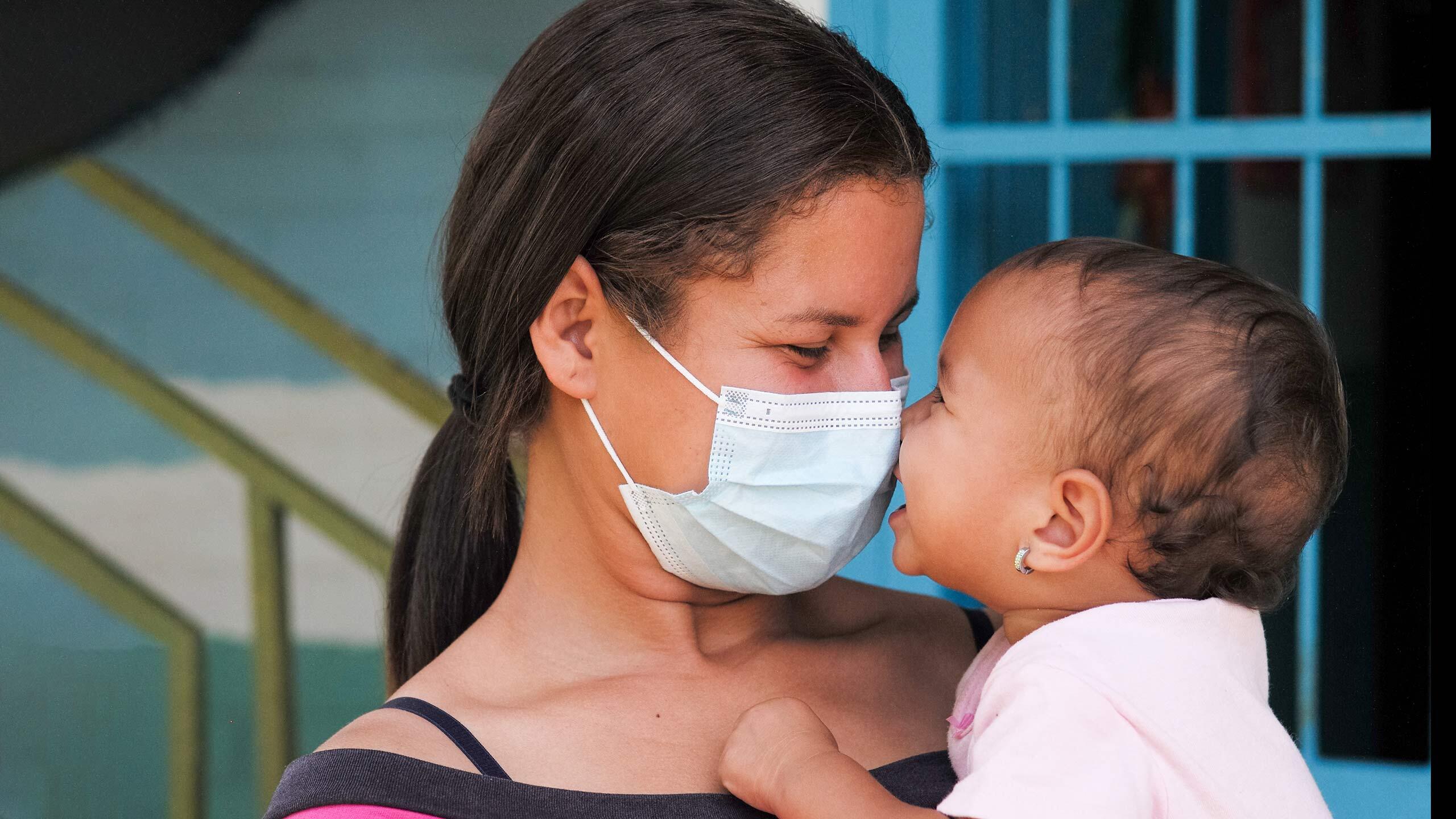 But one thing did not change this year: the tireless dedication of health workers, humanitarian workers, community leaders, grassroots advocates, educators and parents. Despite 12 months of turmoil, their ingenuity, spirit and hope continue to light the way to a brighter future. A young mother and child at a UNFPA-supported health centre in Turmero, Venezuela.